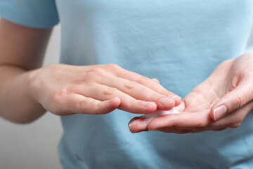 Closeup of a female hand in a cosmetic, cream. Protecting hands from the negative effects of the environment