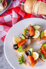 delicious snack tartlets on dark stone background