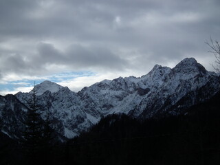 Fototapeta na wymiar High dangerous mountains on a cold winter day.
