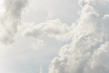 White big fluffy clouds. Natural scenic abstract background. Weather changes backdrop. Sky filled with voluminous clouds.