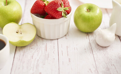 Detox concept. Tasty fruits and berries. Healthly food. Veganism, vegetarianism, raw food diet. Strawberries and apples. Summer fresh fruits. Copy space. Vitamins in food. Healthy breakfast