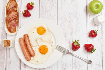 Healthly food. Continental breakfast in hotel room or bed. Fried eggs with sausages. Cup of coffee. Menu template. Cookery. Cooking. Romantic french or rural breakfast on Valentine.