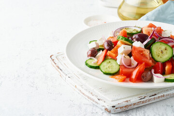 Greek village salad horiatiki with feta cheese, olives, cherry tomato, cucumber and red onion