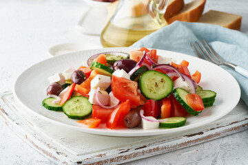 Greek village salad horiatiki with feta cheese, olives, cherry tomato, cucumber and red onion