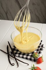 Making Pancakes, Cake, Baker Hands Pouring Batter and Whisking Batter in Bowl. Concept of Cooking Ingredients and Method on White Wooden Background, Dessert recipes and Homemade Food.