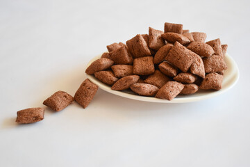 Cereal pillows with chocolate and hazelnut filling for nice and sweet start of the day, brown...