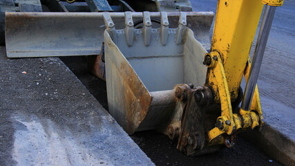 Details of excavator, bulldozer on a street.