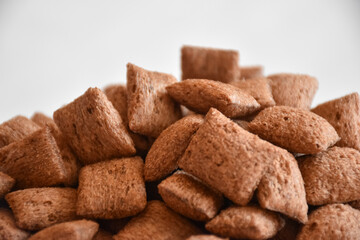 Lot Of Whole Crispy Brown Cereal Pillows Isolated On White Background