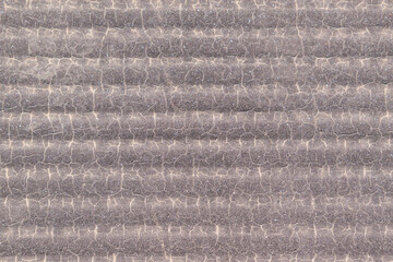 Fototapeta premium Wavy surface for backdrop. Horizontal stripes, creases and cracks with an abstract pattern. Color - Taupe Gray, Blanc, Hue Yellow.