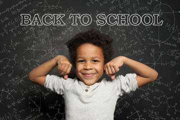 Strong smart happy black child boy student portrait. Back to school concept