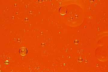 Abstract colorful background with oil drops and waves on water surface