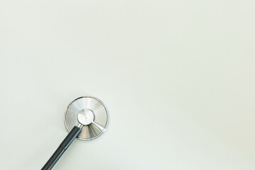 Stethoscope on light background, medical supplies and free space for text
