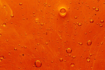 Abstract colorful background with oil drops and waves on water surface