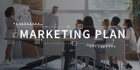 Marketing plan written on group of people discussing work