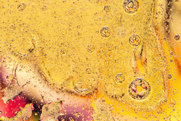 Abstract colorful background with oil drops and waves on water surface