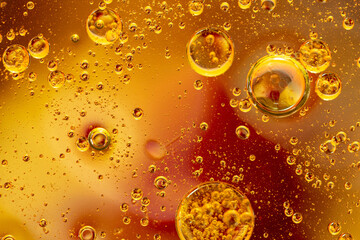 Abstract colorful background with oil drops and waves on water surface