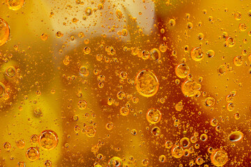 Abstract colorful background with oil drops and waves on water surface