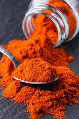 aromatic ground paprika on a dark stone background
