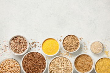 Set with various cereal grains on stone background