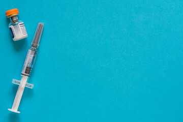 Diabetes. Diabetic coma. Glucagon. Hypoglycemia. Glucagon ampoule. Disposable syringe. A healthy lifestyle diabetic. Blue free background. Shymkent, Kazakhstan May 25, 2020