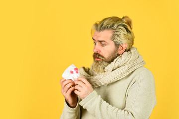 ill man with bloody cough. male tuberculosis problem. Lung Cancer Symptoms. coronavirus from china. coughing blood. pneumonia. sick man hold napkin with blood. sickness allergy concept. copy space