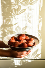 Red easter eggs on a plate.