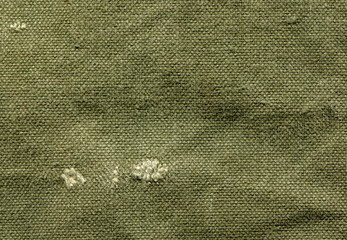 texture background of old canvas tarpaulin in green shade of color