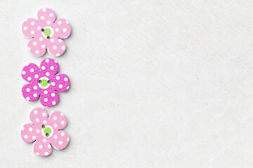 Creative background with decorative wooden buttons shaped like flowers