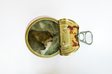 Metal can with mold. Mold. Macro photo. Texture of gray mold on an organic surface. Mold on tomato paste close-up. The lid of a metal can. White background