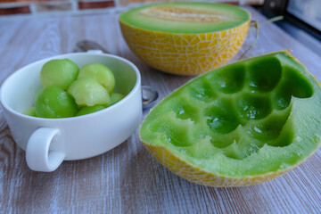 Spoon the cantaloupe into a cup