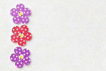 Creative background with decorative wooden buttons shaped like flowers