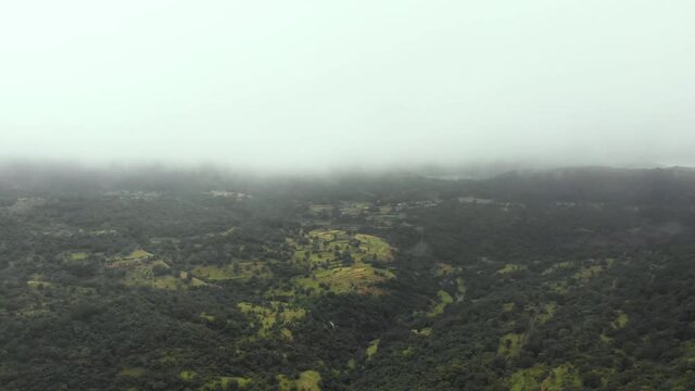 Aerial drone view of flying in mountains in rain, Maharashtra, India