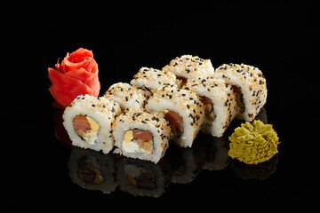Japanese Cuisine - Appetizing Salmon Sushi Set. Philadelphia Sushi Roll - Maki Sushi with Philadelphia Cheese inside on mirror black background. Smoked salmon rolls served on a plate