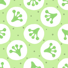 Seamless green polka dot pattern with frog footprints.