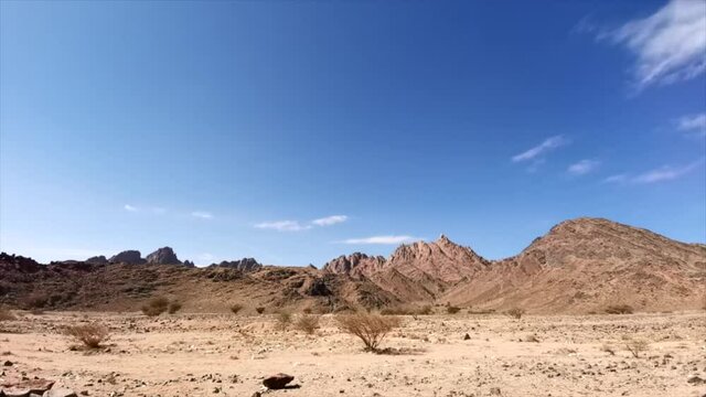 4K Timelapse of clouds movement during hot, haze and bad weather in desert mountain. Travel and landscape