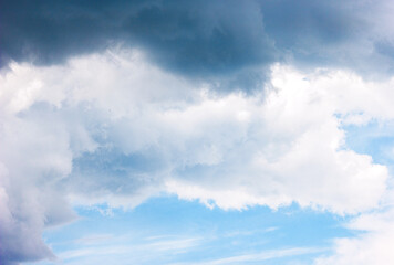 The sky and clouds in layers - dark, white and sky blue