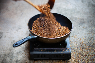 Traditional roasting coffee at home,  freshly roasted coffee beans.