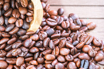 Wood cask with roasted coffee beans heap