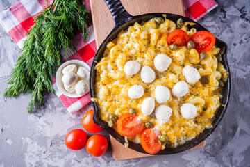 delicious pasta and cheese casserole in a cast iron skillet