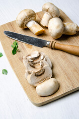 Mushrooms cut on cutting board