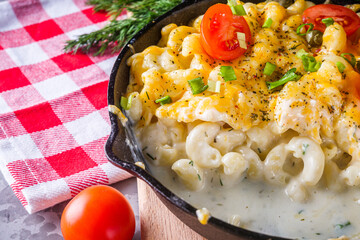 delicious pasta and cheese casserole in a cast iron skillet