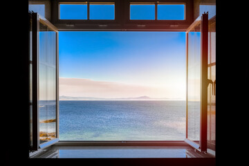 view from a dark room to the sea through an open window - Powered by Adobe