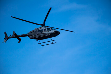 Image of a helicopter flying in a mountain area of kedarnath uttarakhand