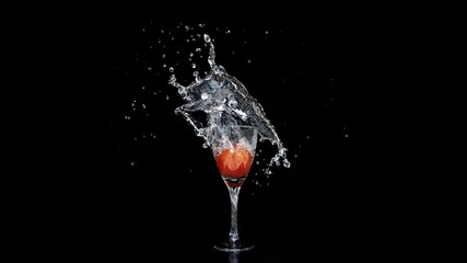 beautiful splash of liquid into wine glass