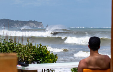 surfing a wave in Japan , lareg waves created by Tyhoon swell in Asia.