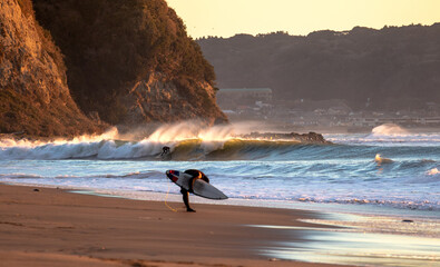 surfing a wave in Japan , lareg waves created by Tyhoon swell in Asia.