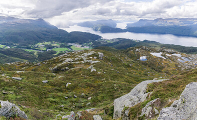 Fototapeta na wymiar View from Hellandsnuten Mountain to town of Sand and five Fjords. Sandsfjord, Hylsfjord, Saudafjord, Vindafjord and Lovrafjord. Norway.
