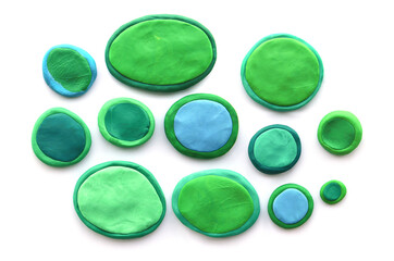 Set of colorful plasticine buttons isolated on white background. Abstract  round bubbles made of modeling clay,.