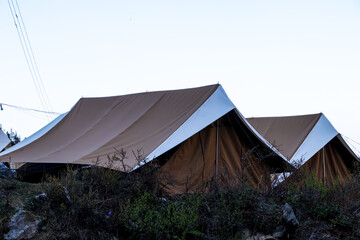 Images of tents for tourists at hilly area