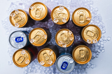 Group of aluminium cans in ice, cold drink.